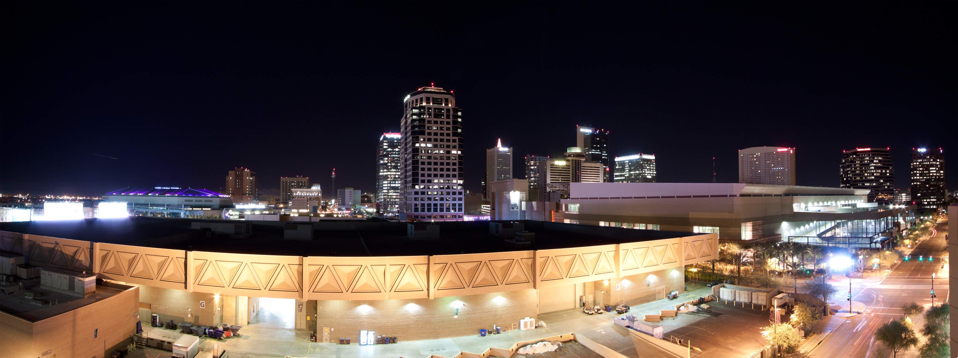 Downtown Phoenix buildings and streets illuminated at night