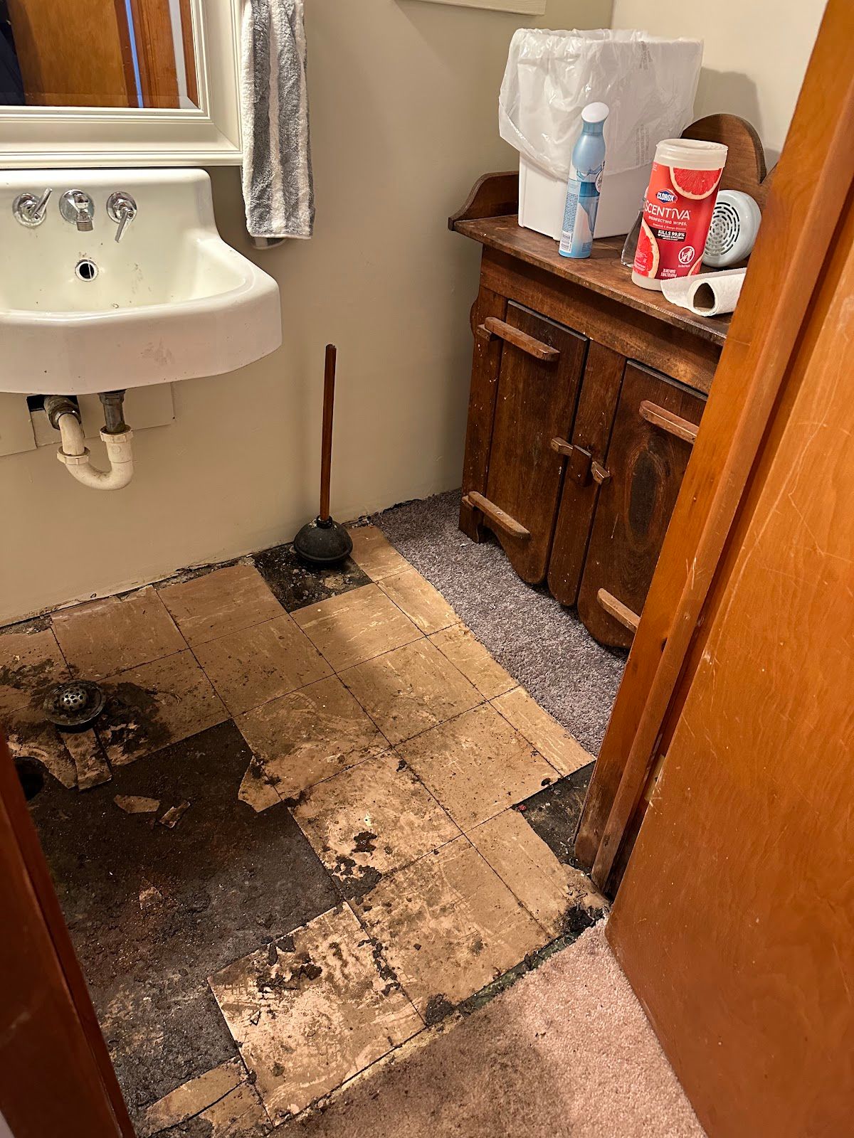 Damaged bathroom floor around a drain